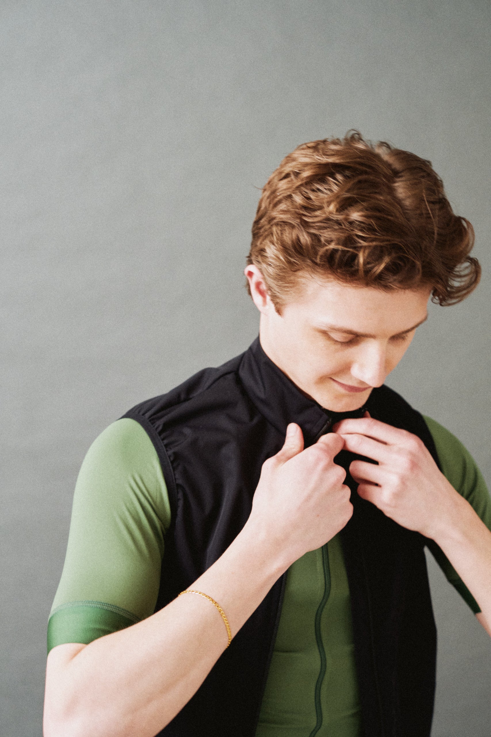 FAR FROM HOME cycling clothing. Green jersey and black wind-block gilet